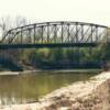 The old k-43 river bridge. I was located on North Bridge Street until it was replaced in the late 1980's. The picture was taken during construction of the new bridge, notice the dirt work in the lower right.